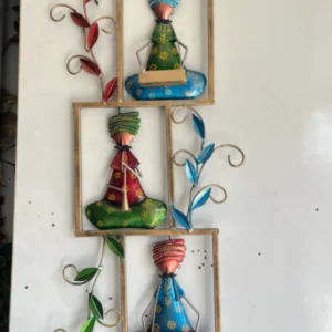Handcrafted traditional musician wall art with colorful ethnic metal décor for living room interiors.