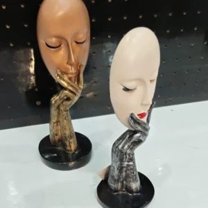 Modern abstract face showpiece with artistic hand sculpture design for luxury contemporary home décor.