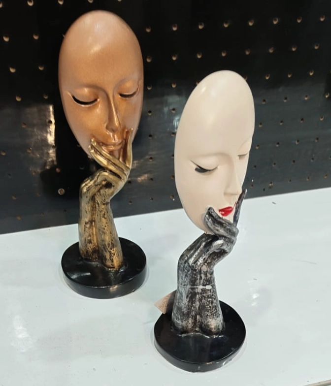 Modern abstract face showpiece with artistic hand sculpture design for luxury contemporary home décor.