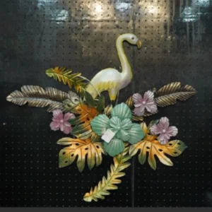 Elegant flamingo metal wall decor with tropical floral artwork for luxury living room interiors.