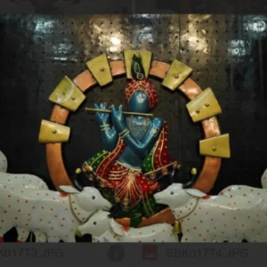 Traditional Krishna cow wall decor with handcrafted metal artwork for spiritual living room interiors.
