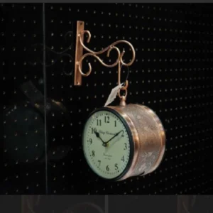 Vintage hanging wall clock with antique metal design for living room décor.