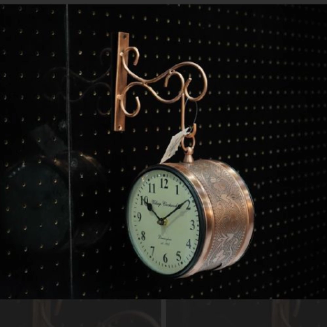 Vintage hanging wall clock with antique metal design for living room décor.
